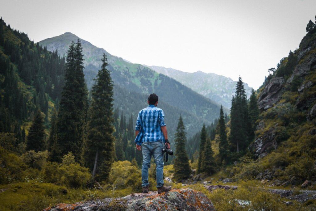 negative-space-male-photographer-adventure-trees-mountains