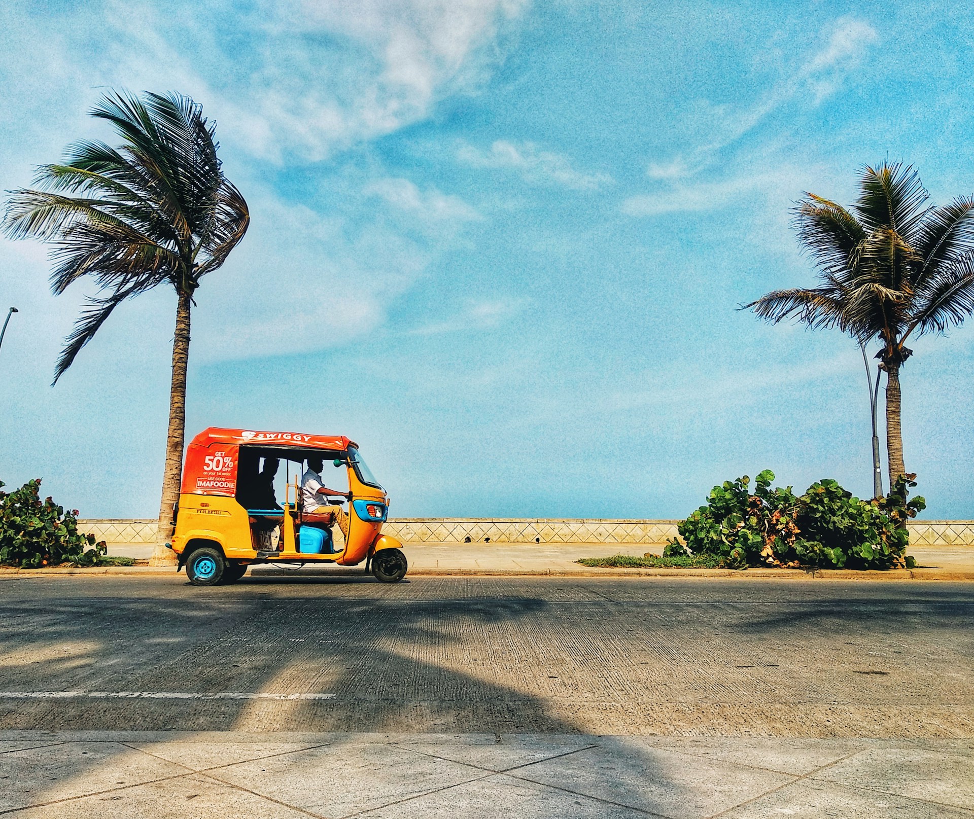 orange and black auto on road during daytime in Pondicherry