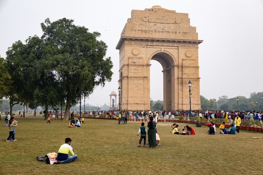 People chilling at India Gate during daytime